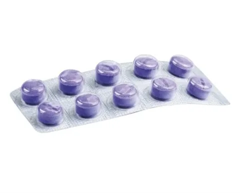 Lizdinė plokštelė su dešimčia apvalių violetinių apnašas dažančių tablečių